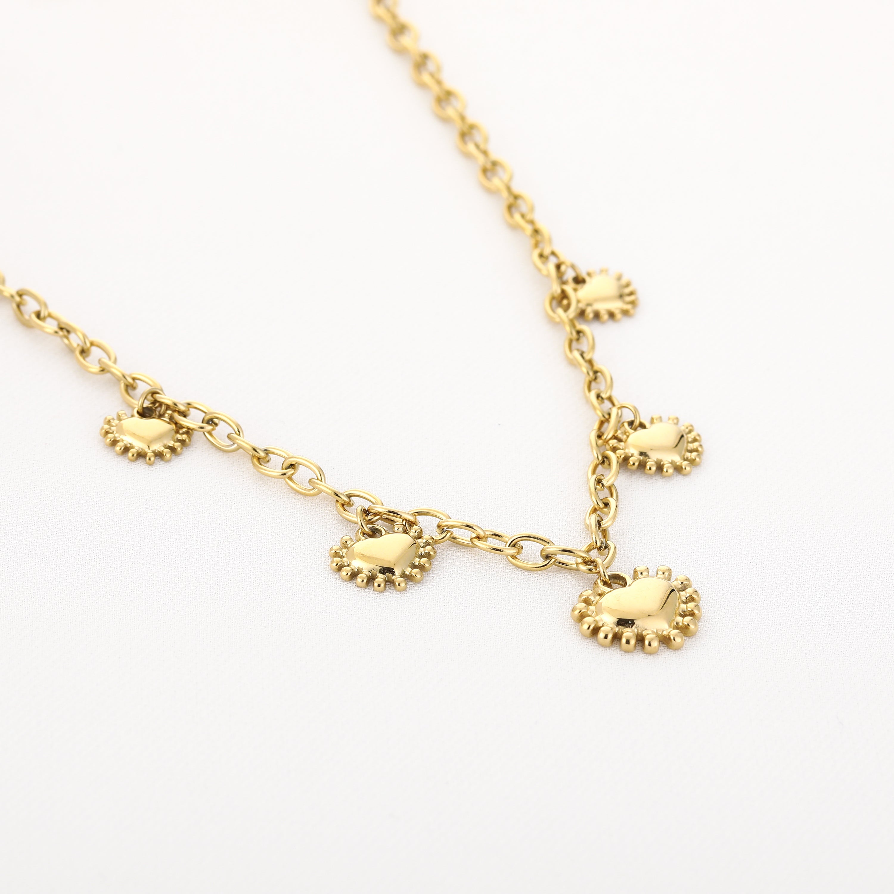 Schakelketting goud zon hart bedels